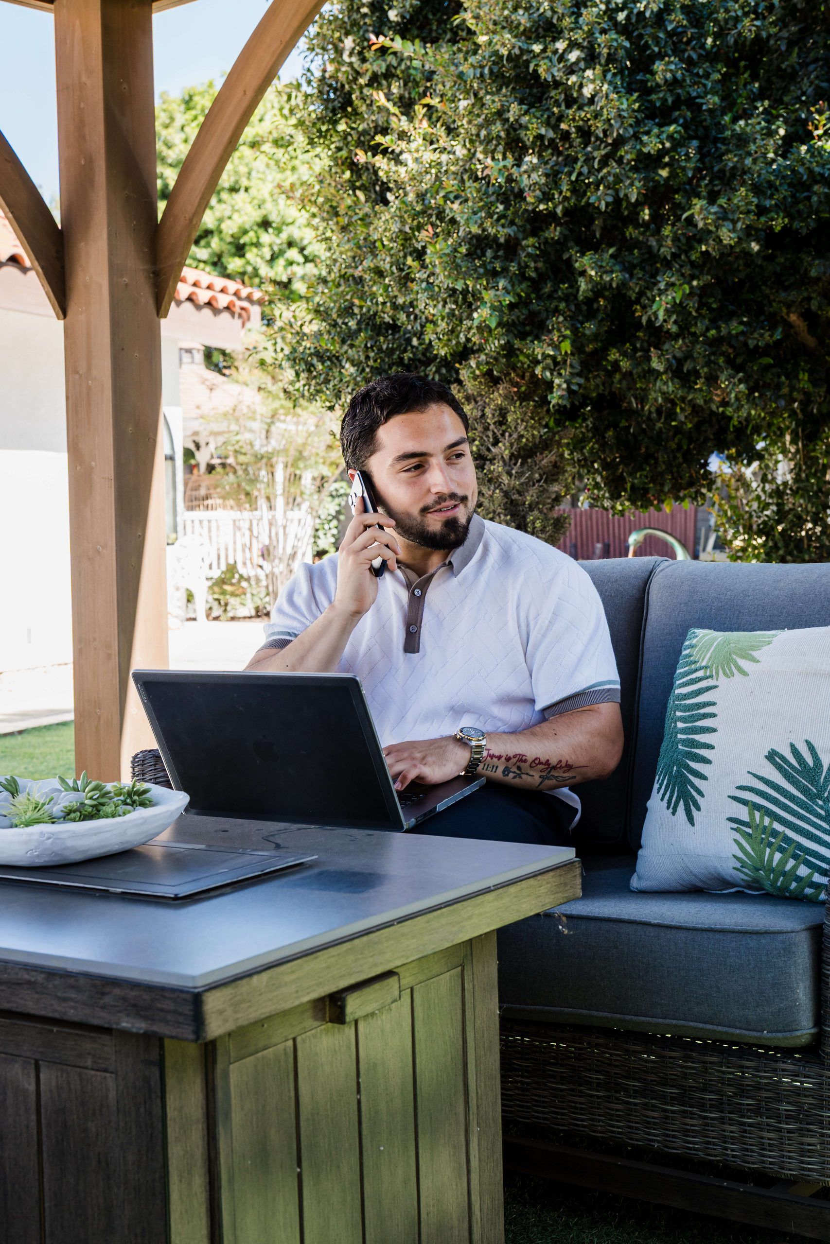 Roberto Valadez on the phone in a Santa Maria backyard